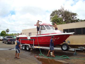 Cleaning up the new boat after the sea trial at the fire station
