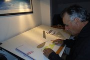 Don doing a drawing for the new owner, Rick Lowe