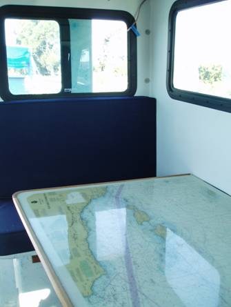 Dinette table with chart of Channel Islands