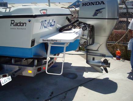 The Stainless Marine outboard bracket doubles as a swim step