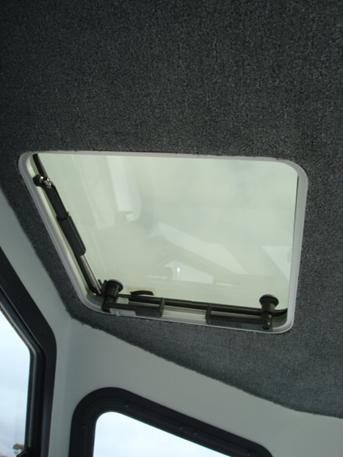 Ventilation hatches above helm and passenger seats