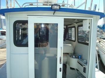 Rear sliding door and mini galley to the right