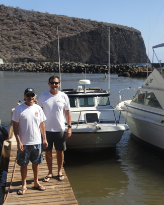 Don and Bill Parsons in front of Bill’s 24’ Radon in the Lanai harbor